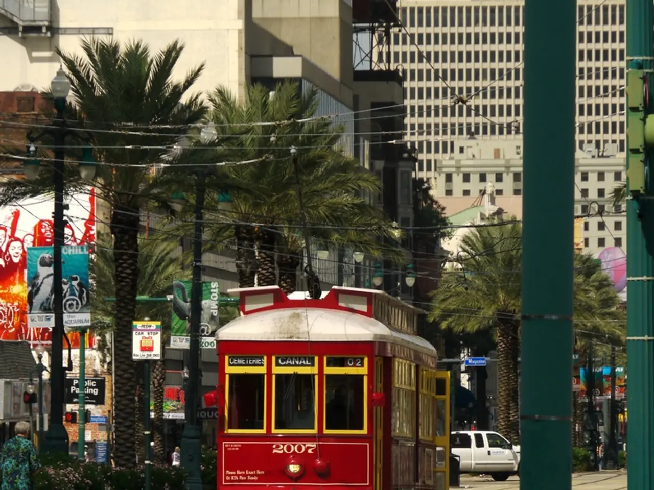 This is an outside view, in this image in the center there is one bus and in the background there...