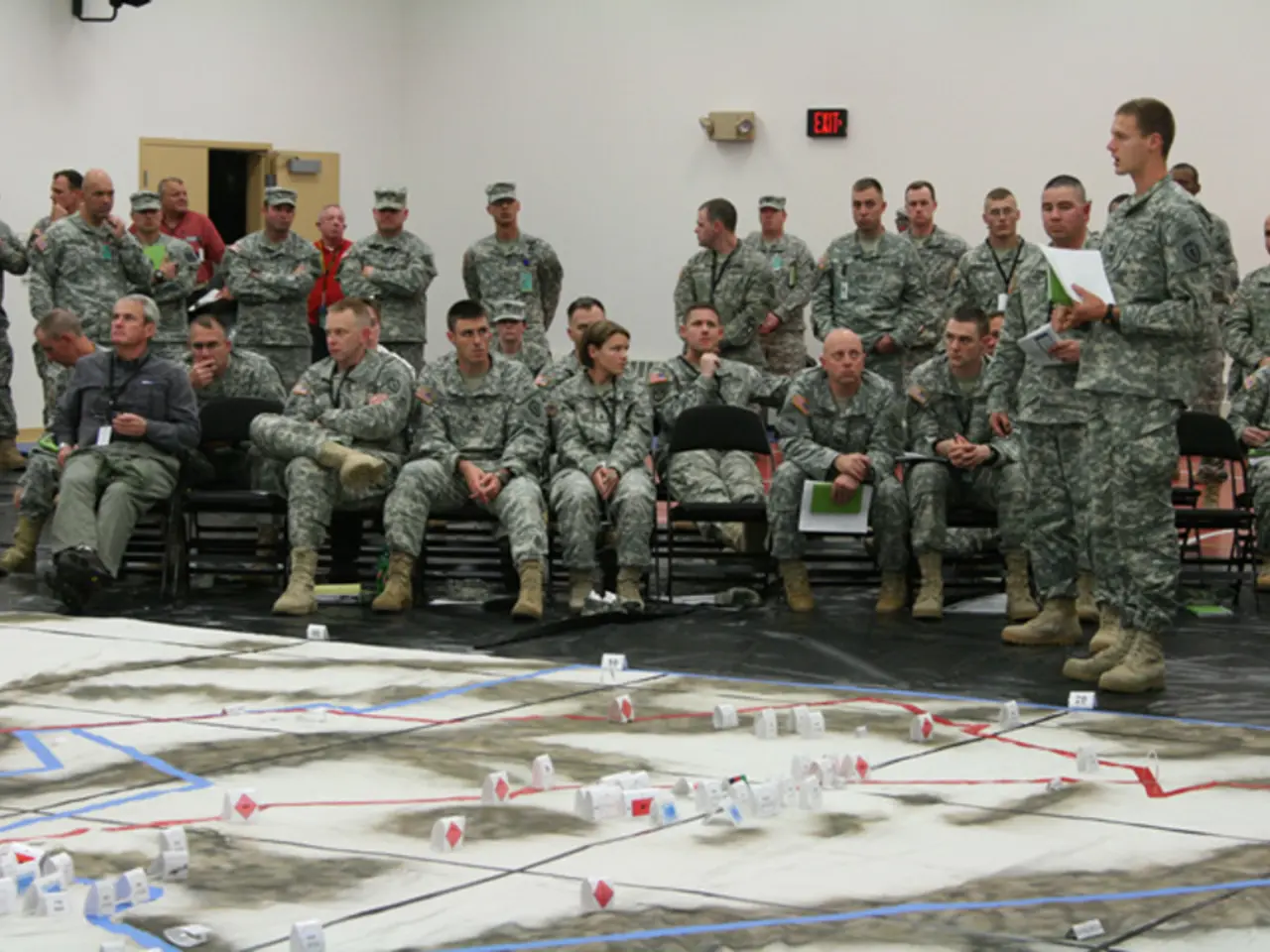 There are groups of people and standing. This looks like an exit board, which is attached to the...