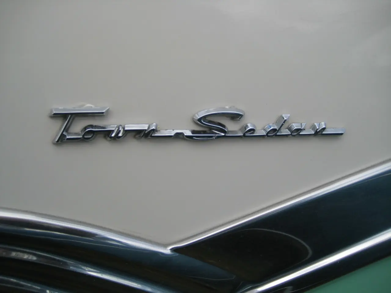 In this image we can see a label name of a car.