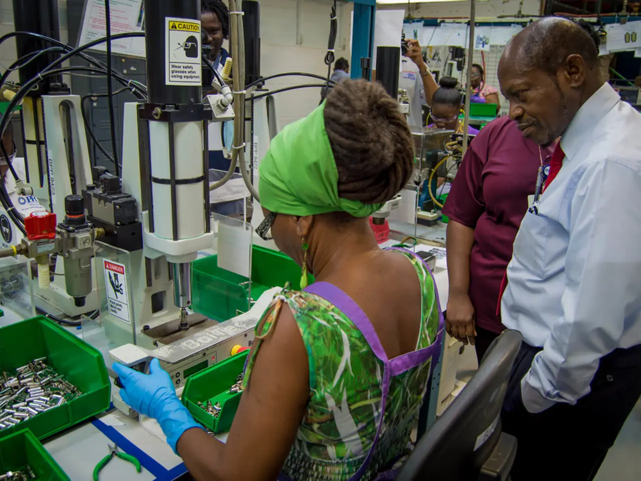 In this image there are people. In the center there is a woman working with the machine and there...