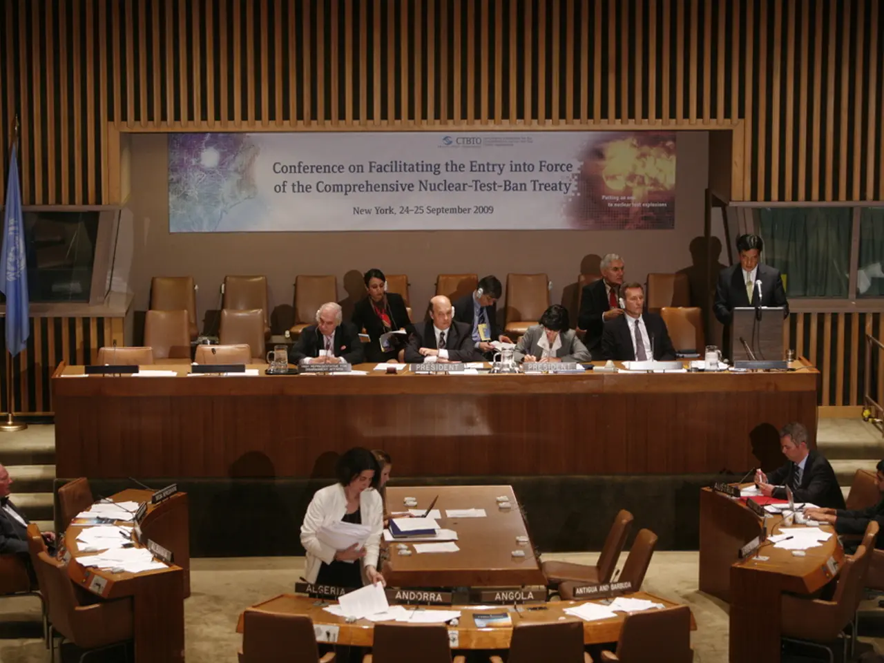 This is an image clicked inside the room. In the middle of the image there are few people sitting...