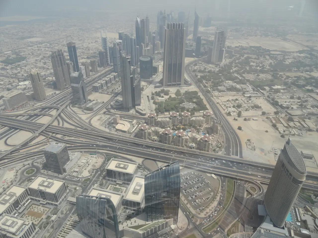 In this image, we can see some buildings and roads.