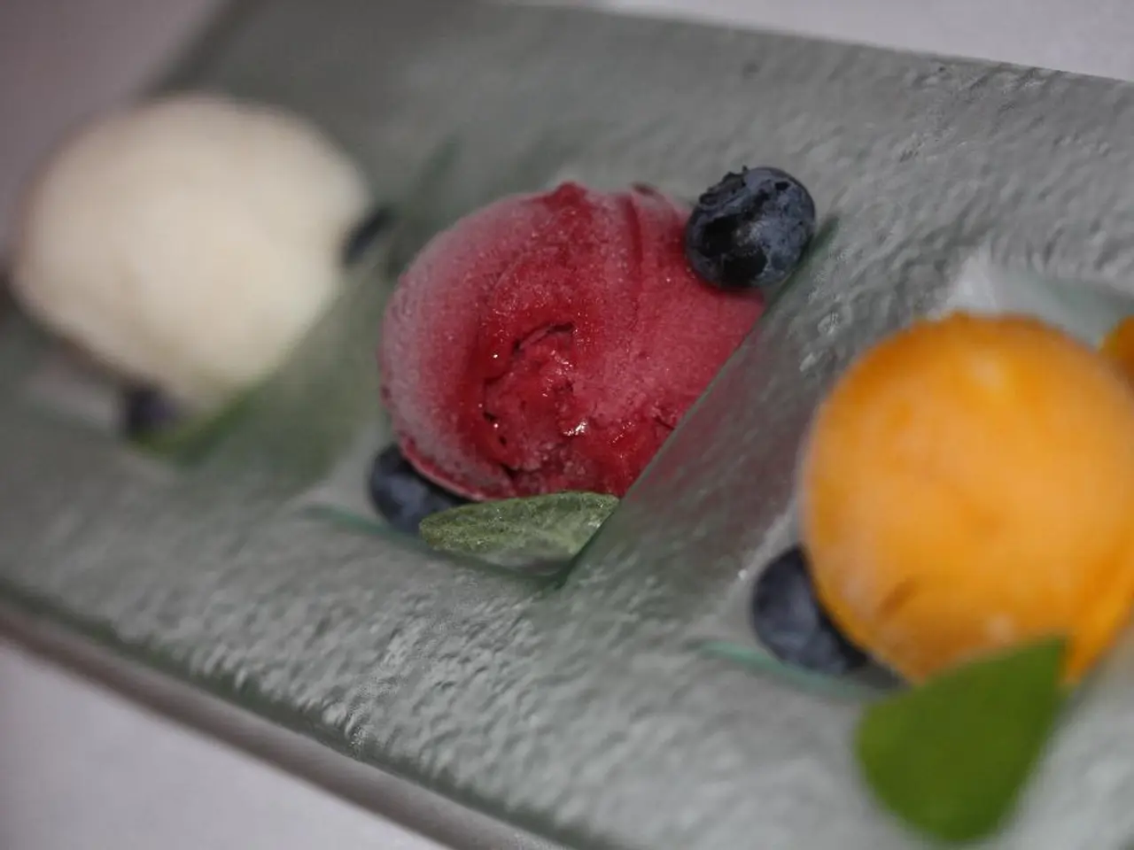 Here in this picture we can see flowers and fruits present on a place over there.