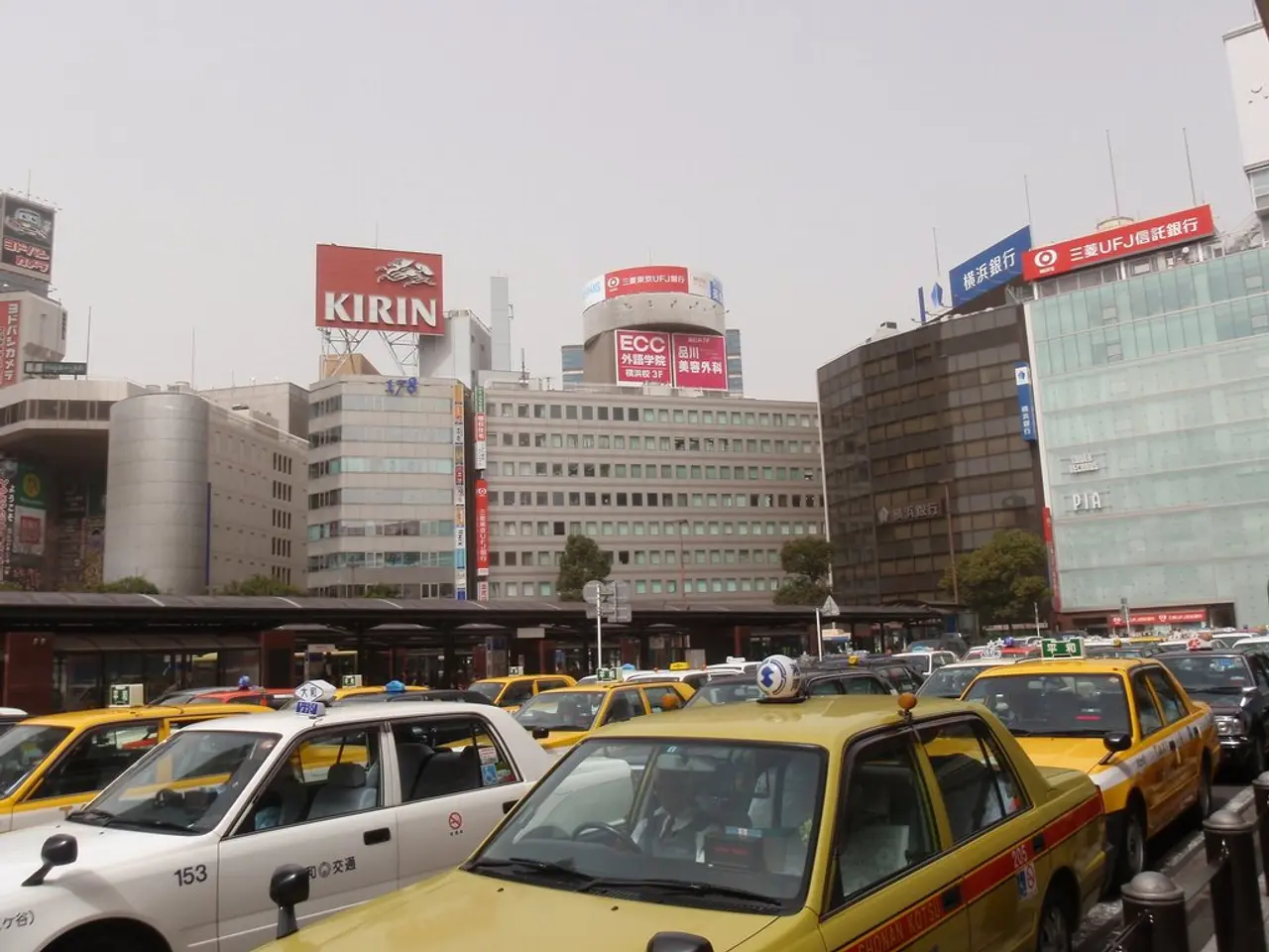 This is the picture of a city. In this image there are vehicles on the road. At the back there are...