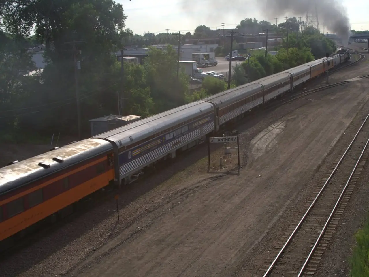 In this image there is a train on the tracks, to the right of the train there are tracks on the...