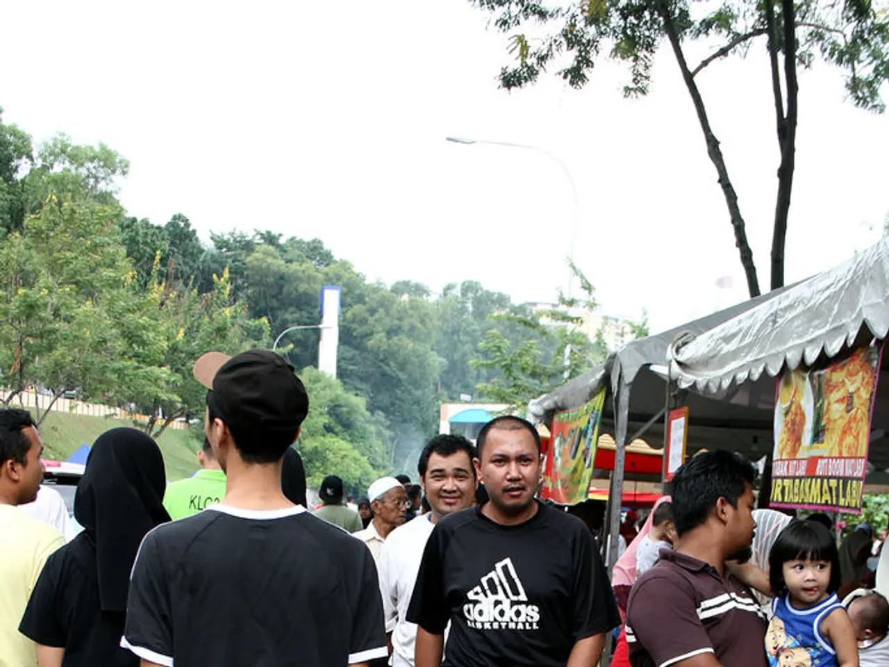 This picture is clicked outside. In the foreground we can see the group of persons and we can see...
