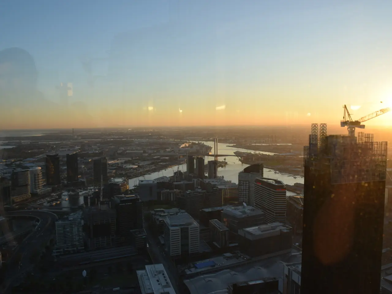 In this image we can see the aerial view of the city. There are so many buildings at the bottom and...