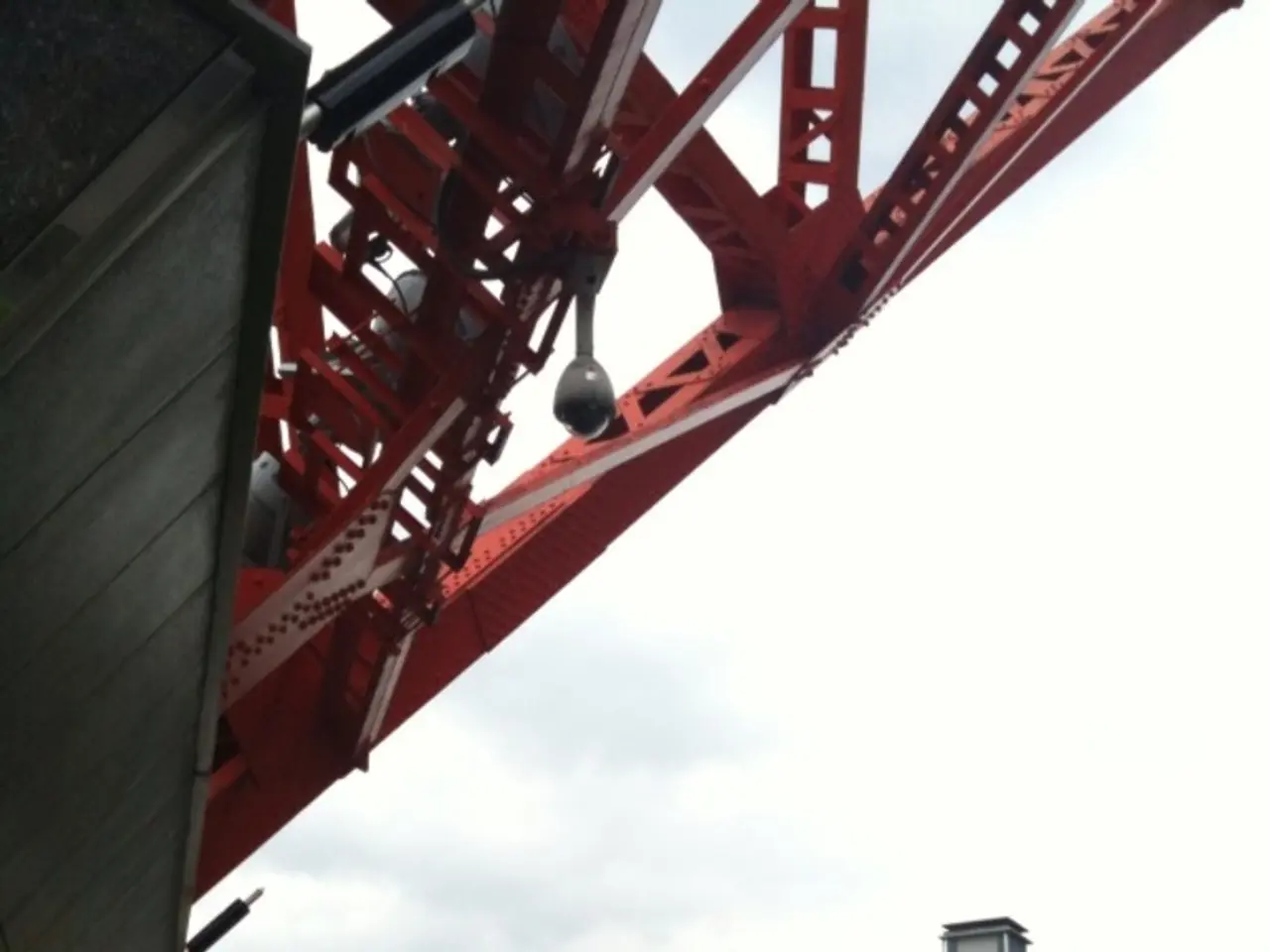 In this image there are people and we can see buses on the road. In the background there are...