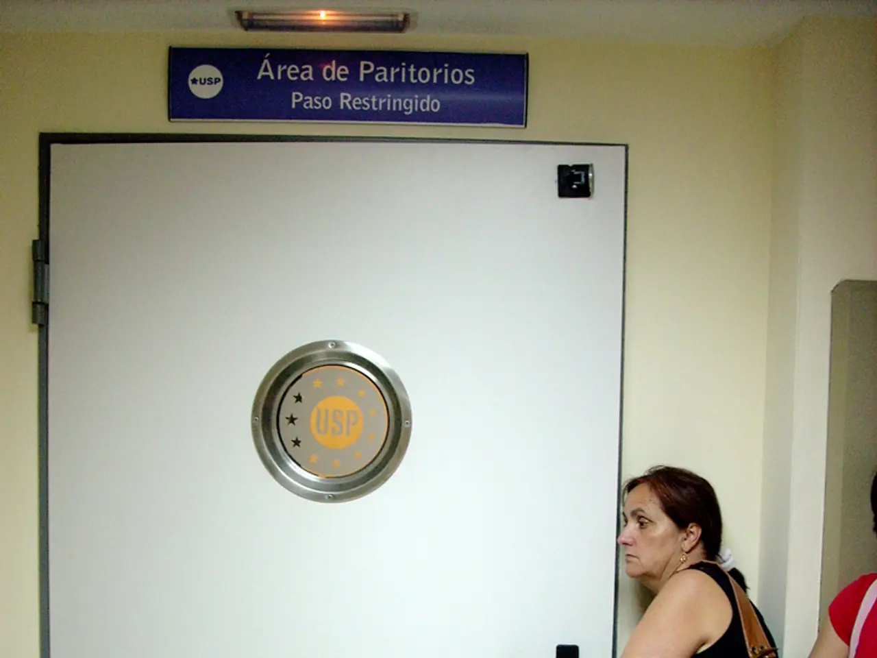 In this image on the right side there are two women standing and they are holding handbags and in...