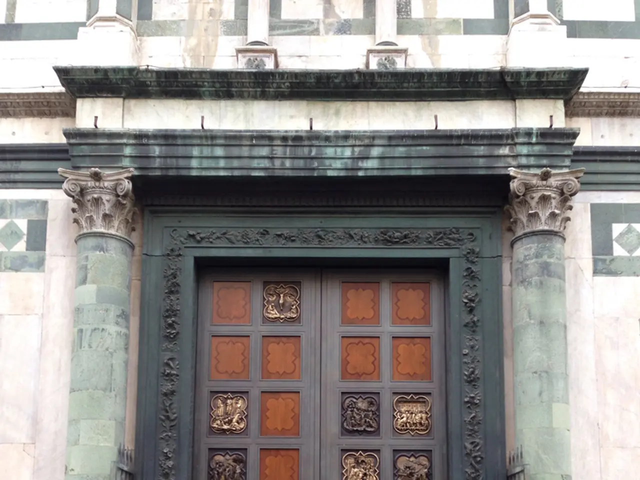 This image contains a door to the wall. Before it there is a pavement. On door there is some...