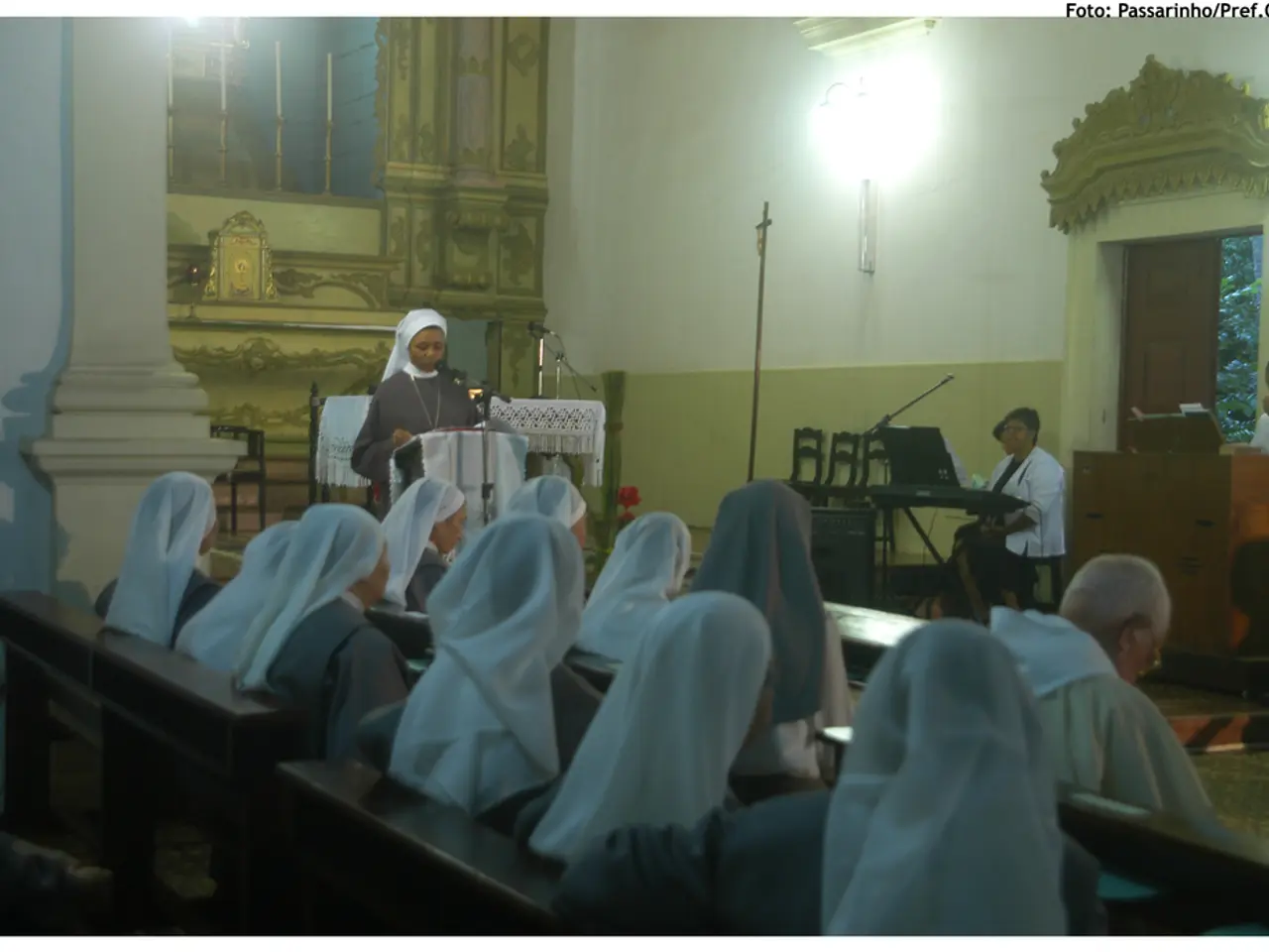 In this image we can see this people sitting on bench. We can see this woman is standing at the...