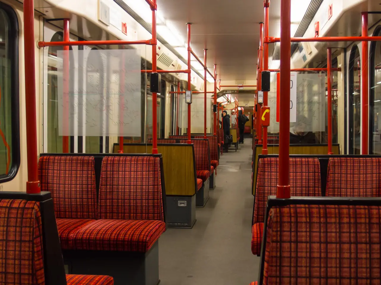 This picture is taken inside the bus. In this image, we can see seats in the bus, on the right...