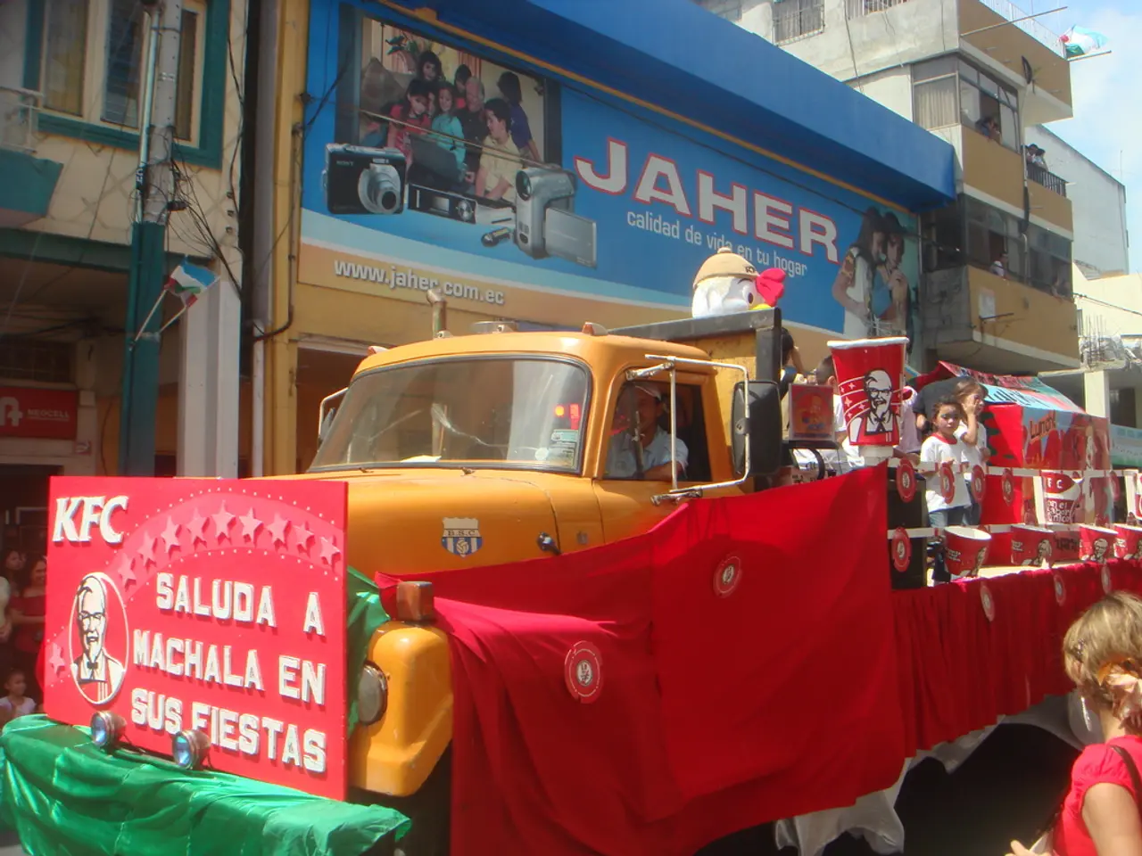 In this picture we can see group of people and a truck, we can see few people and buckets in the...