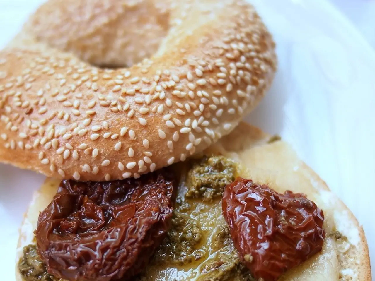 This image consists of some eatables. It looks like a burger.