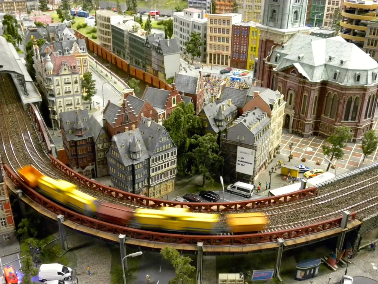 In this image there is a road at the bottom. There are vehicles, people and buildings on the left...