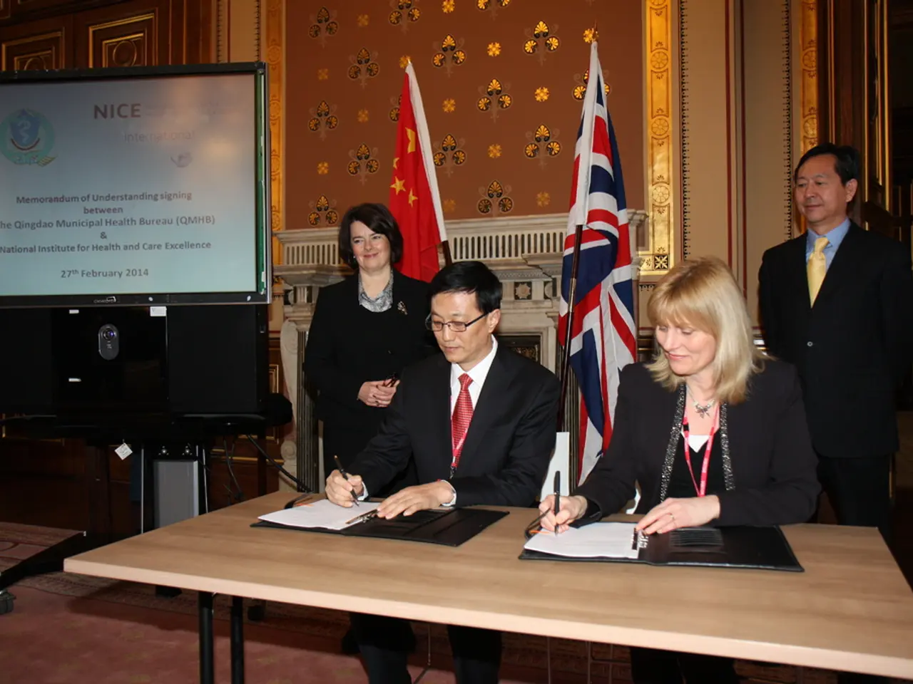 In this picture there is a man who is sitting on the chair. Beside him there is a woman who is...