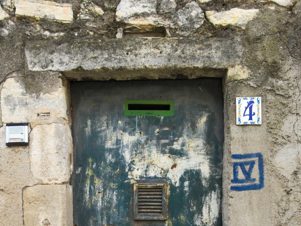 In this image, there is a door which is attached to the wall.