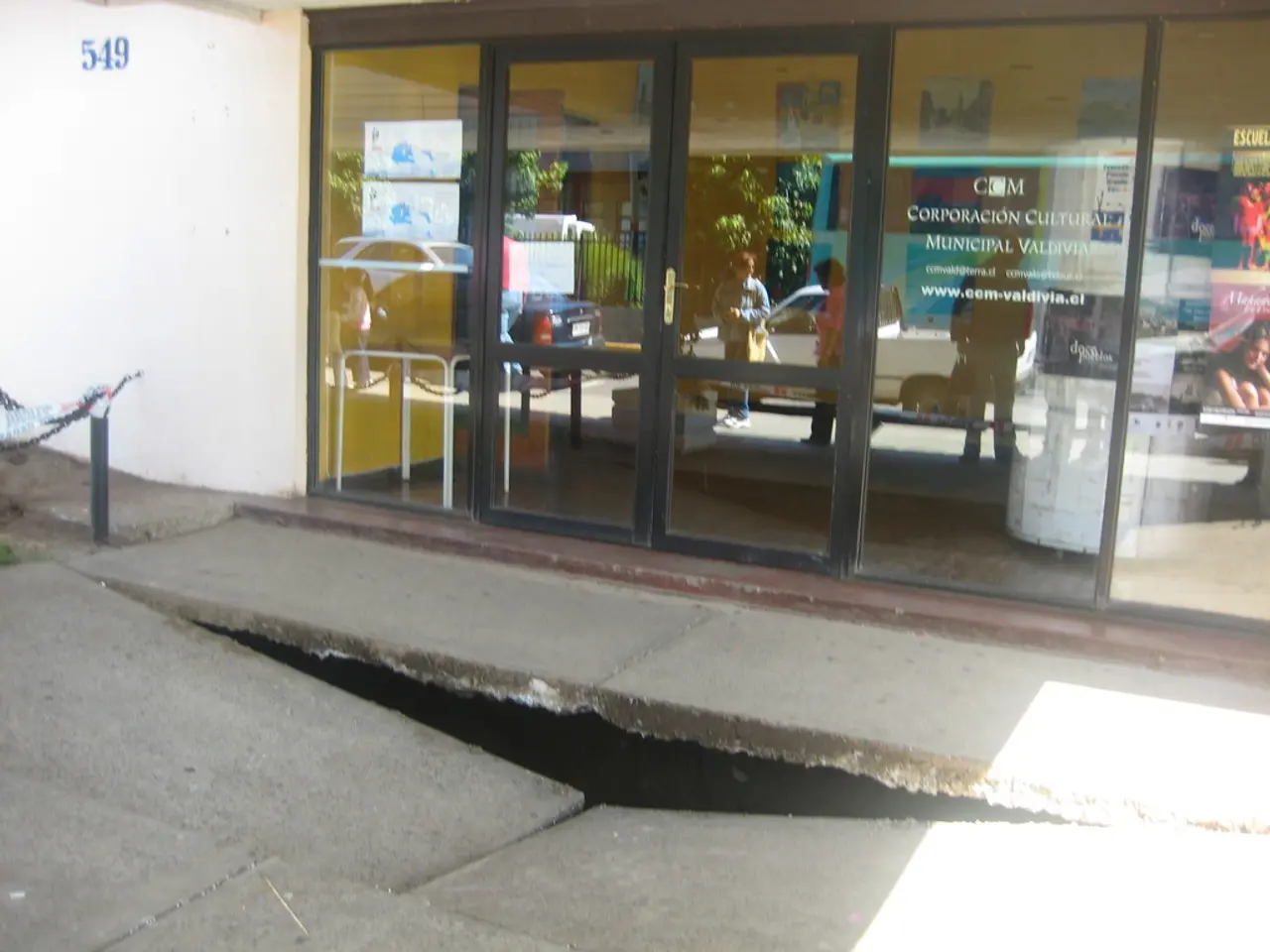 In the foreground of this picture, there is a broken surface. In the background, there is a glass...