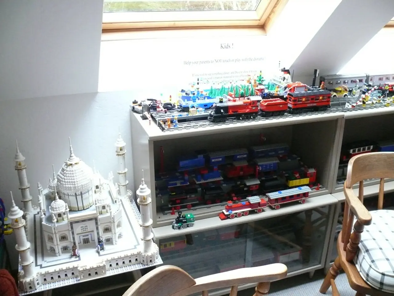 In this picture there is a glass window at the top center side of the image, there is a chair at...