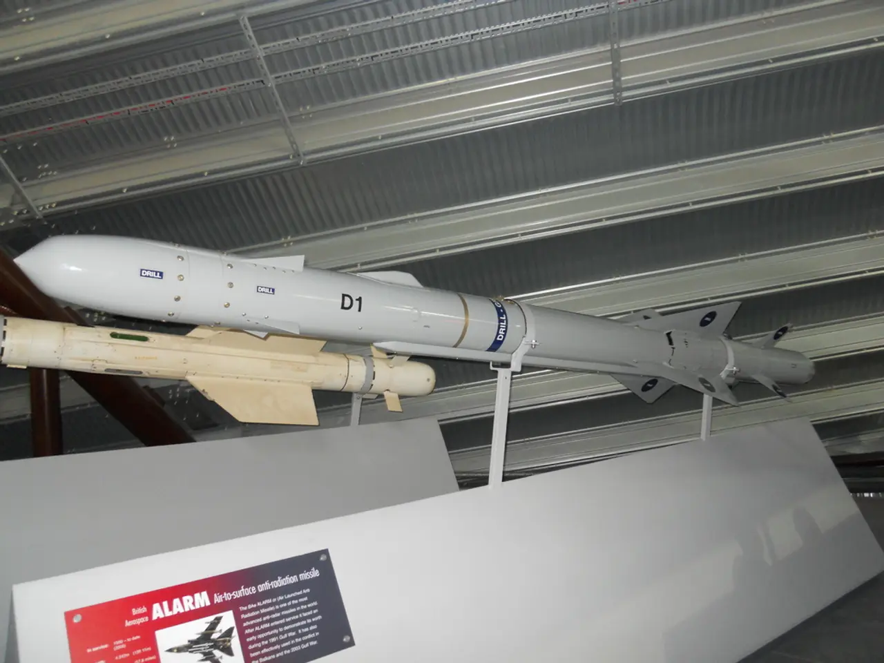 In this picture, we see the missiles. At the bottom, we see the boards in white color. In the left...