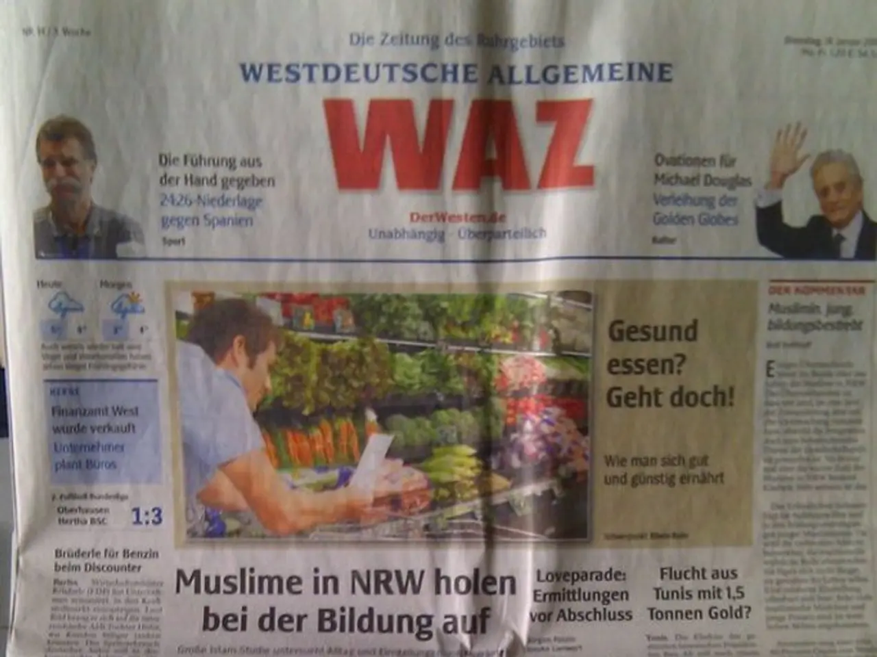 Here in this picture we can see a news paper present and on that we can see some pictures and text...