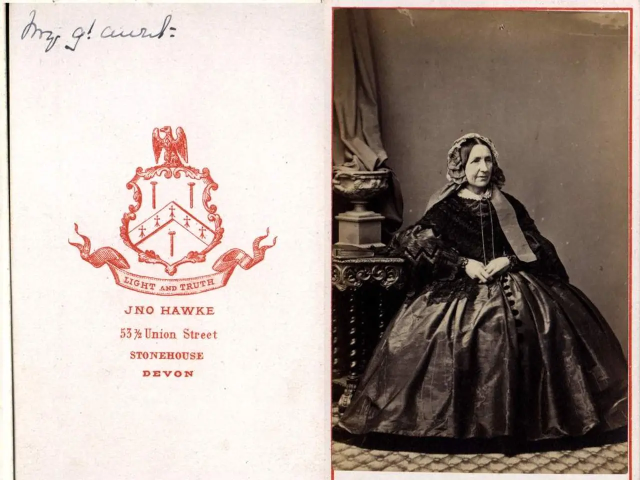 In this image there is a picture of lady sitting on the chair beside that there is a pillar and...