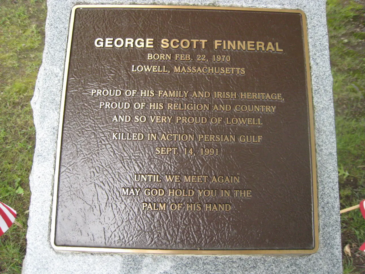 There is a headstone which has something written on it.