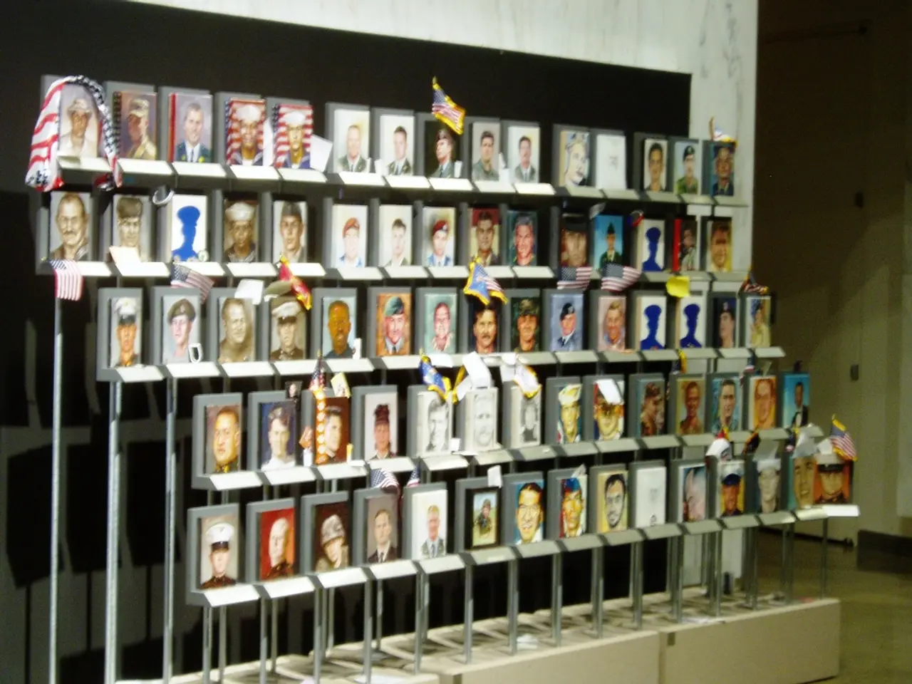 As we can see in the image there is wall, few flags and photo frames.