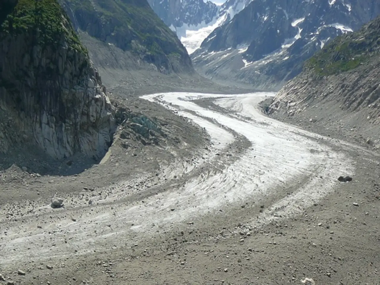There are people climbing on the ladders in the foreground area of the image, there are stones,...