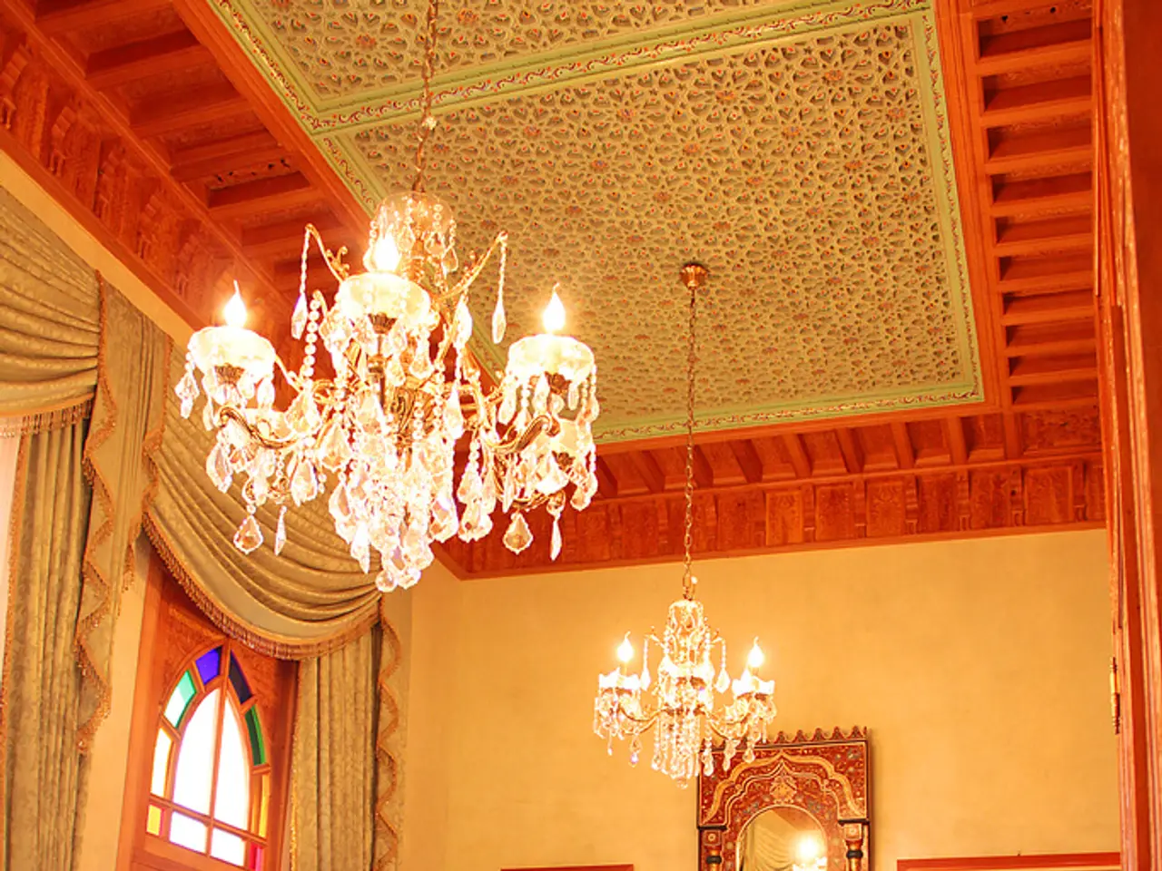 This image is clicked inside the building in a living room. In the front, there is a table on which...