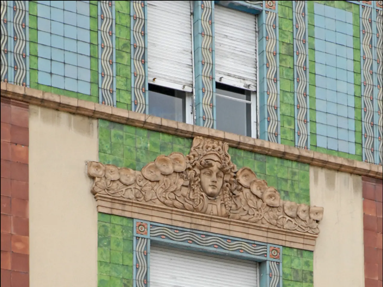 In this picture we can see shelter on the wall. On the top we see two windows and window blind. On...