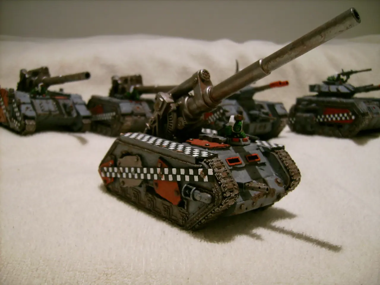 This picture contains panzers placed on the white color cloth. In the background, it is white in...