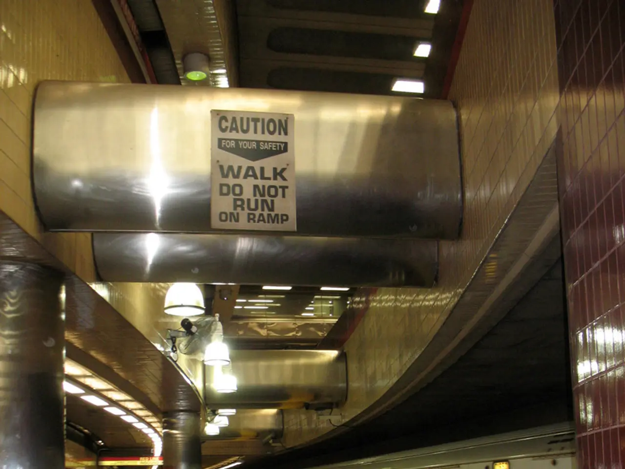 This is inside view of a railway station where we can see train and platform. And platform people...
