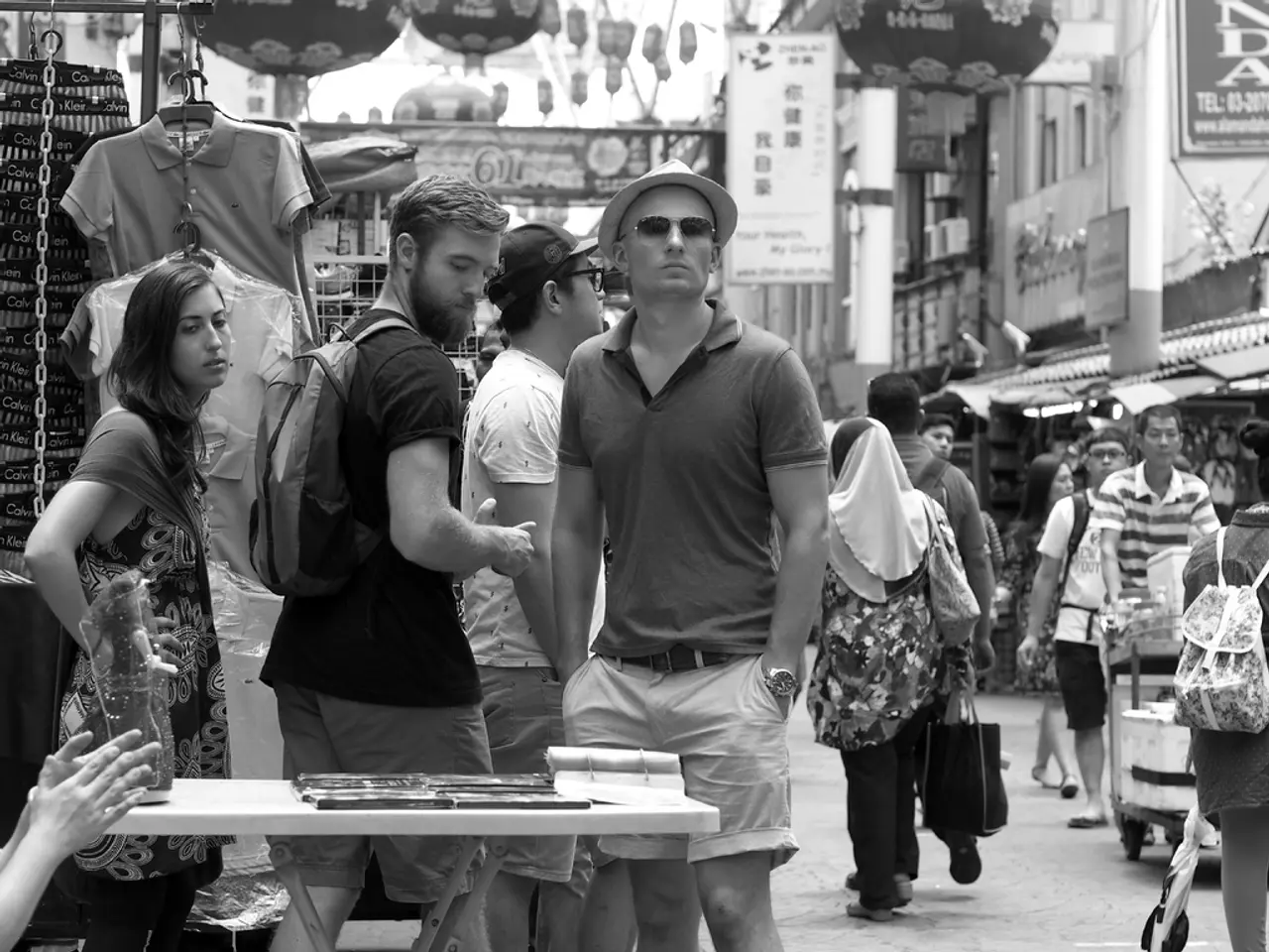 In this picture there are people and stalls on the right and left side of the image, it seems to be...