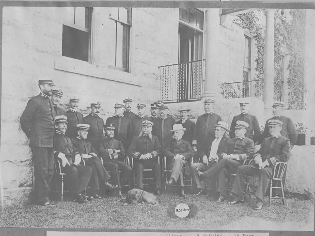 In the image in the center, we can see a few people are sitting on the chairs and few people are...