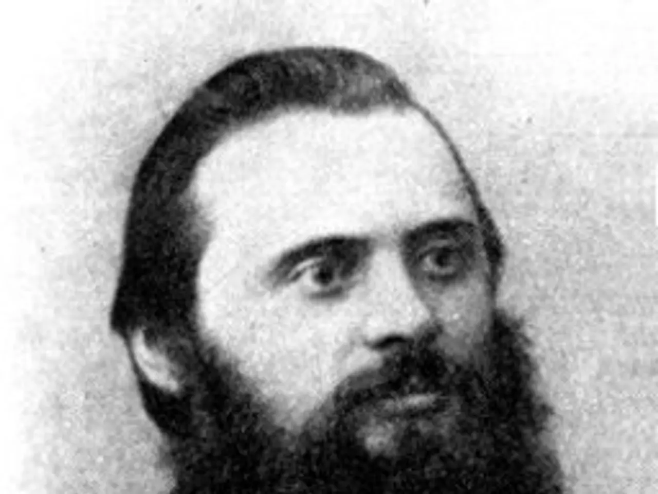 The image shows a black and white photo of six men with long beards, all of whom are believed to be...