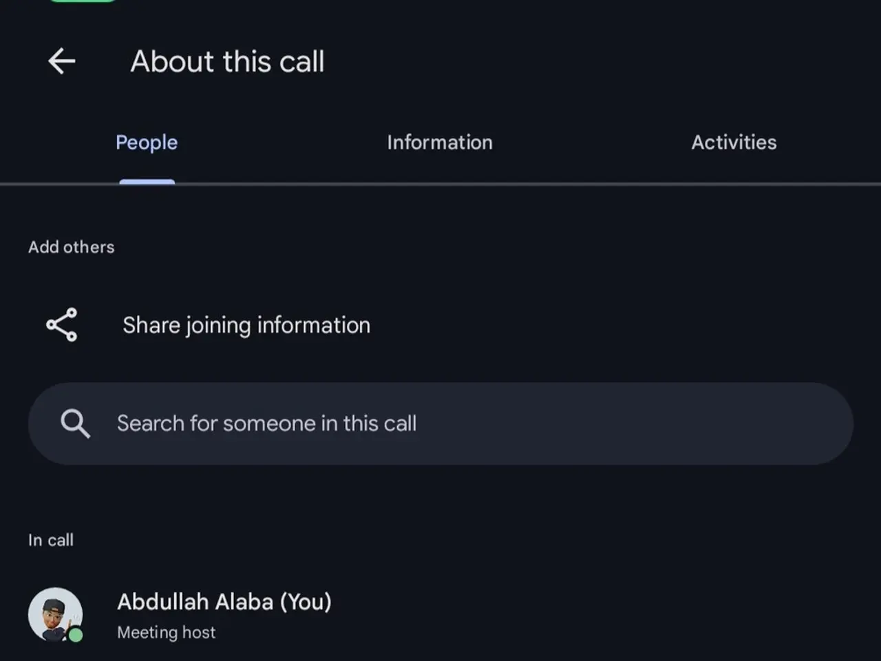 The image shows a screenshot of a cell phone with a group of people on the screen, along with text...