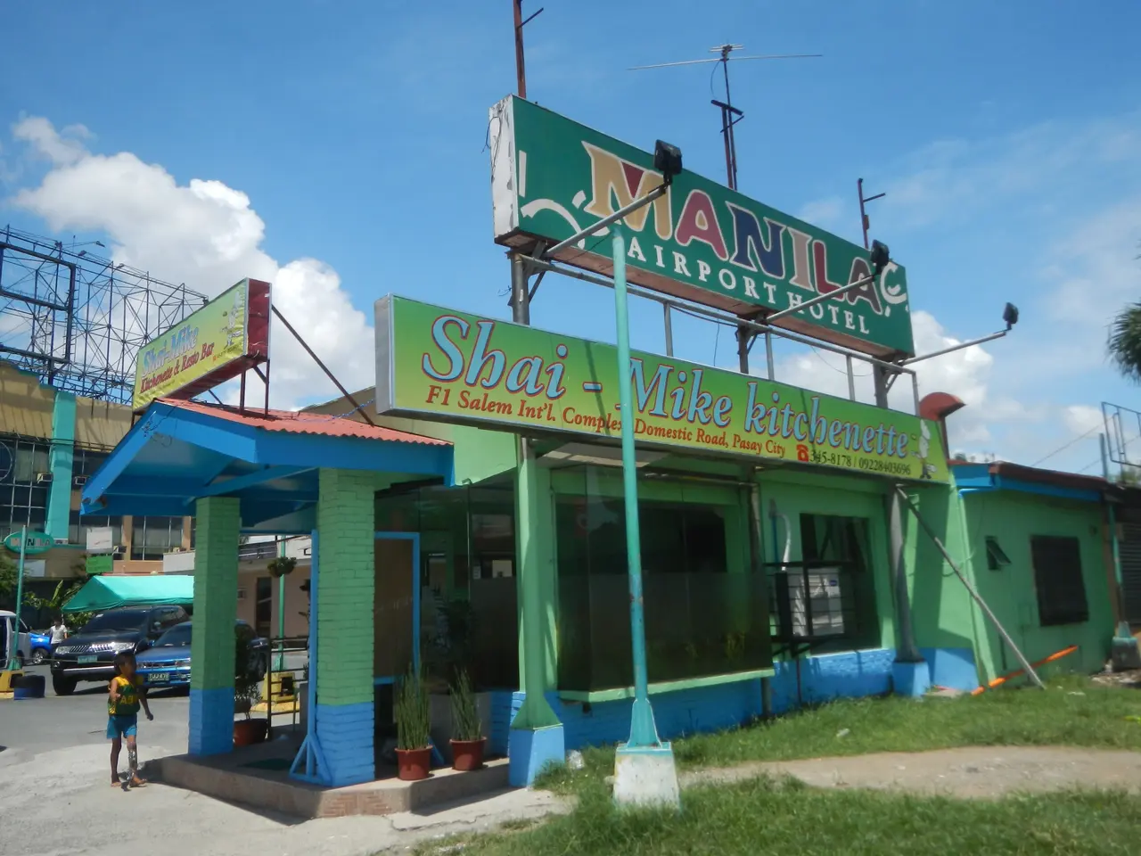 The image shows the Manila Airport Hotel in Manila, Philippines. It is a building with windows,...