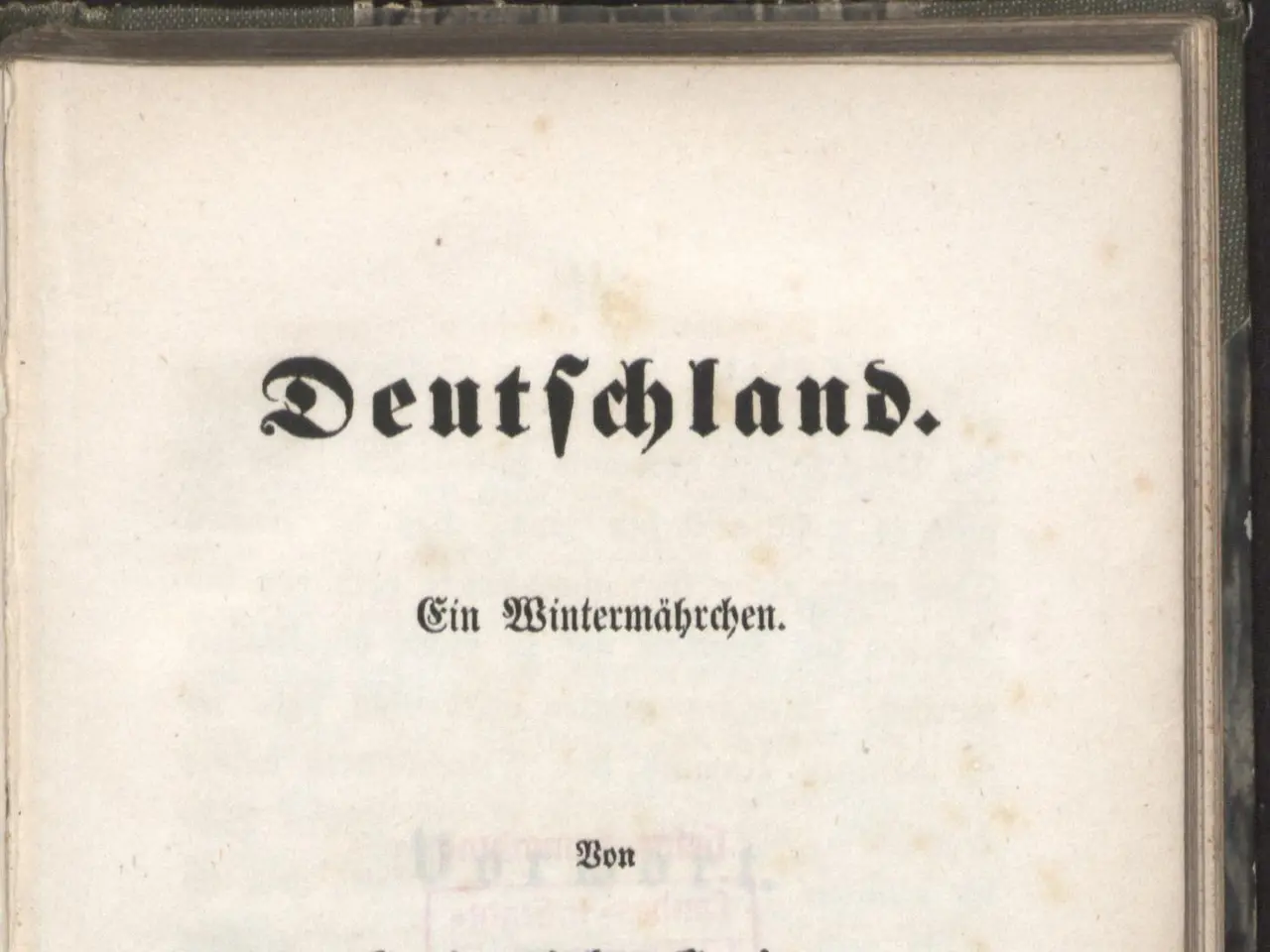 The image shows an old book with the title "Deutschland" written on it against a black background.
