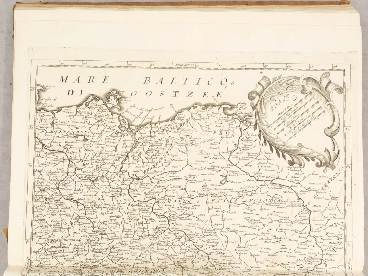 The image shows an old book with a map of Germany on it. The map is detailed and shows the various...