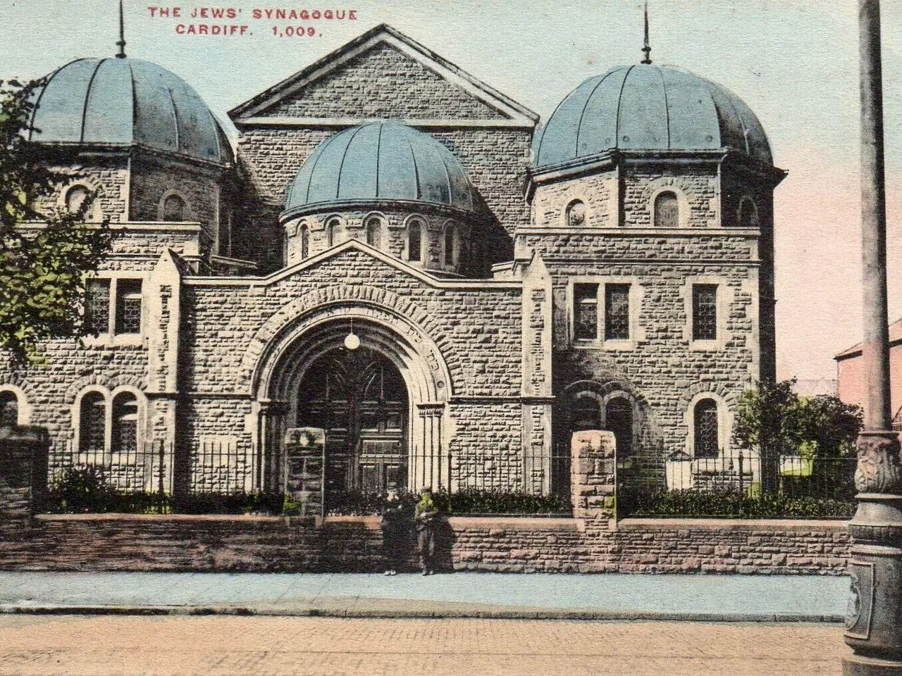 The image shows an old postcard of the Jewish Synagogue in Cardiff, Ontario, Canada. It features a...