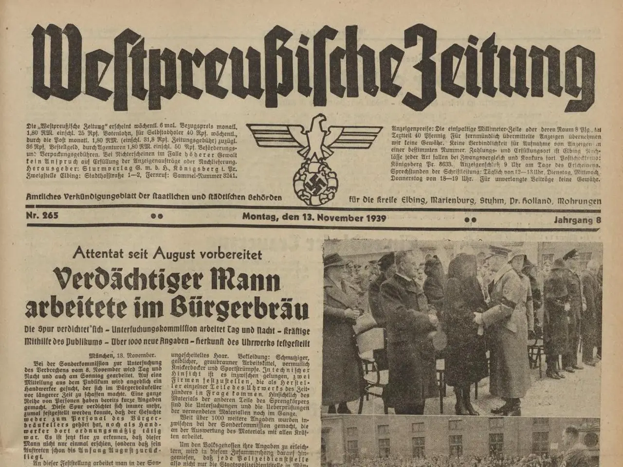 The image shows an old newspaper with a picture of a group of people on it. The newspaper is the...