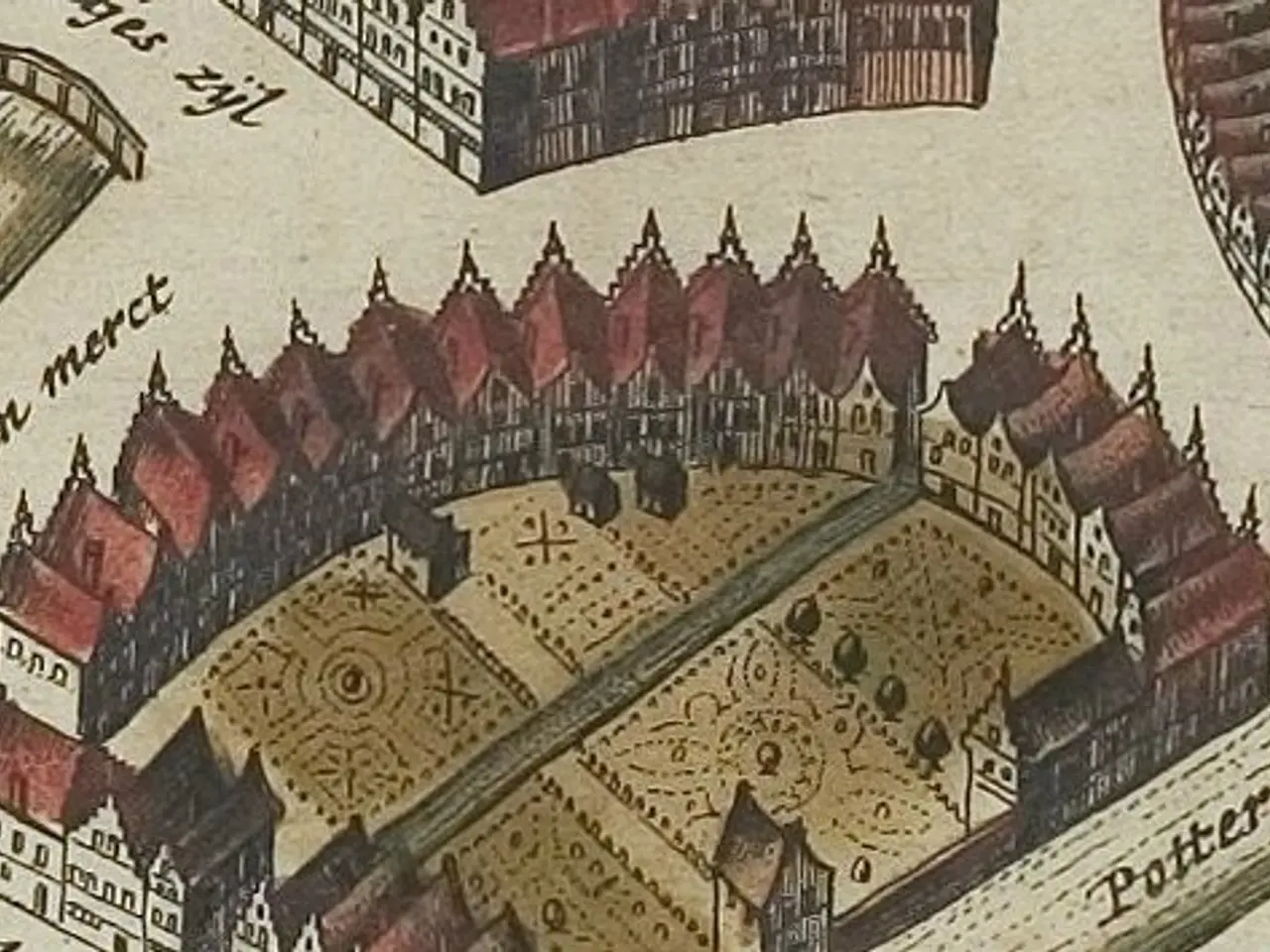 The image shows an old map of a city with a lot of buildings, including a castle, and text written...