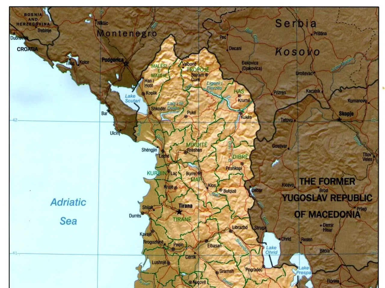 The image shows a poster of a political map of Albania, with text and a border around it. The map...