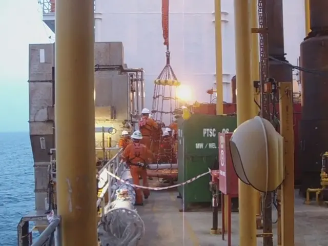 Recovered tugboat submerged in Bremen's commercial harbor.