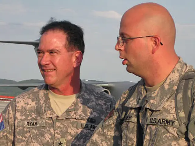 In the image there are two army soldiers and the first soldier is shaking hand with another...