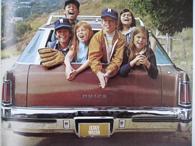 In this image I can see a group of children are sitting in a car and the children are smiling.