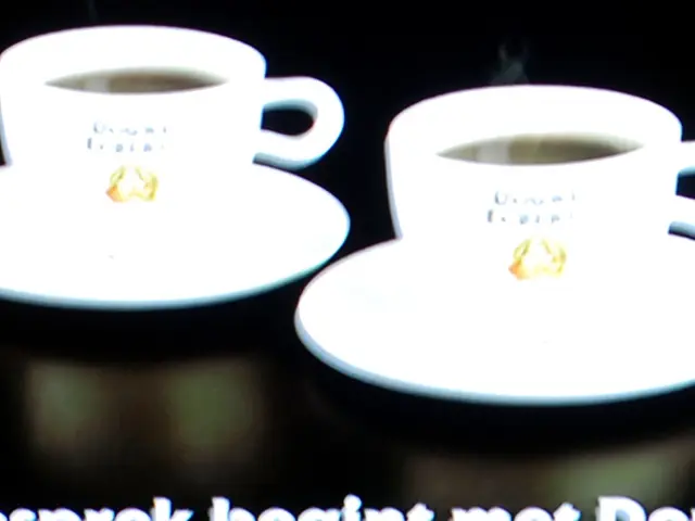 In this image we can see there are cups and saucer with drink. And there is a text written on it.