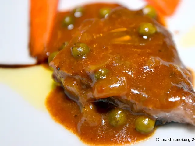 In this image there are food items on a plate. There is some text at the bottom of the image.