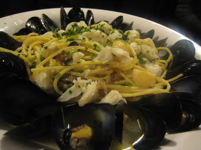 In the foreground of this image, there is some food in a bowl.